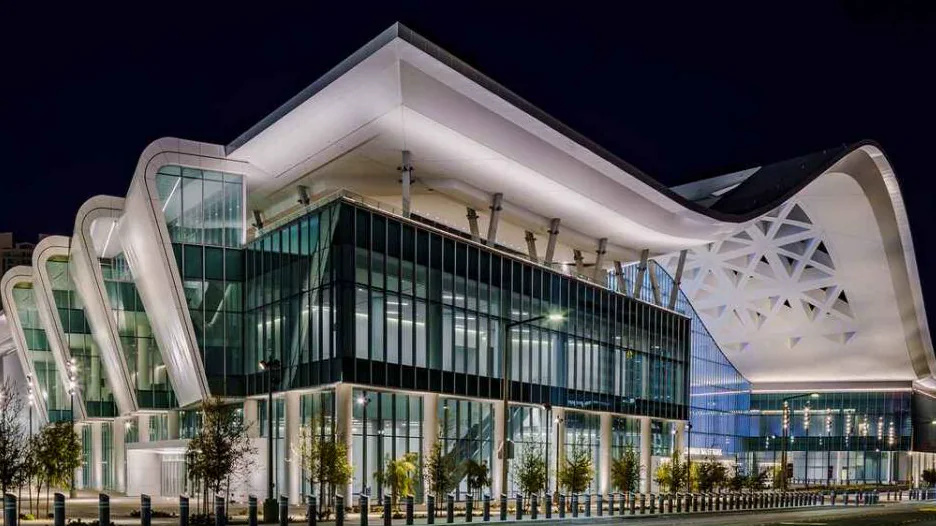 Illustrative Las Vegas convention-district scene at blue hour with modern architecture and desert context