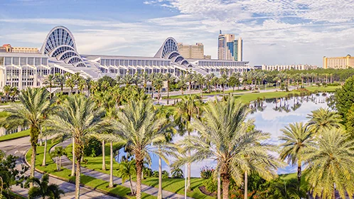 Illustrative Orlando convention-district planning scene with broad pedestrian approaches and subtropical landscaping